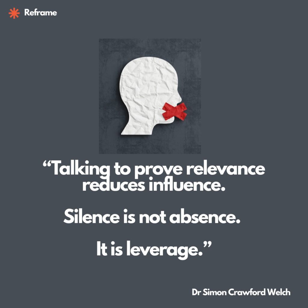 A crumpled white paper silhouette of a head in profile with a red tape X over the mouth on a dark gray background. The taped mouth represents the deliberate choice not to speak. The crumpled texture suggests imperfection and humanity, while the silence is reframed not as suppression but as a conscious act of restraint that amplifies authority. The quote reads: "Talking to prove relevance reduces influence. Silence is not absence. It is leverage."
