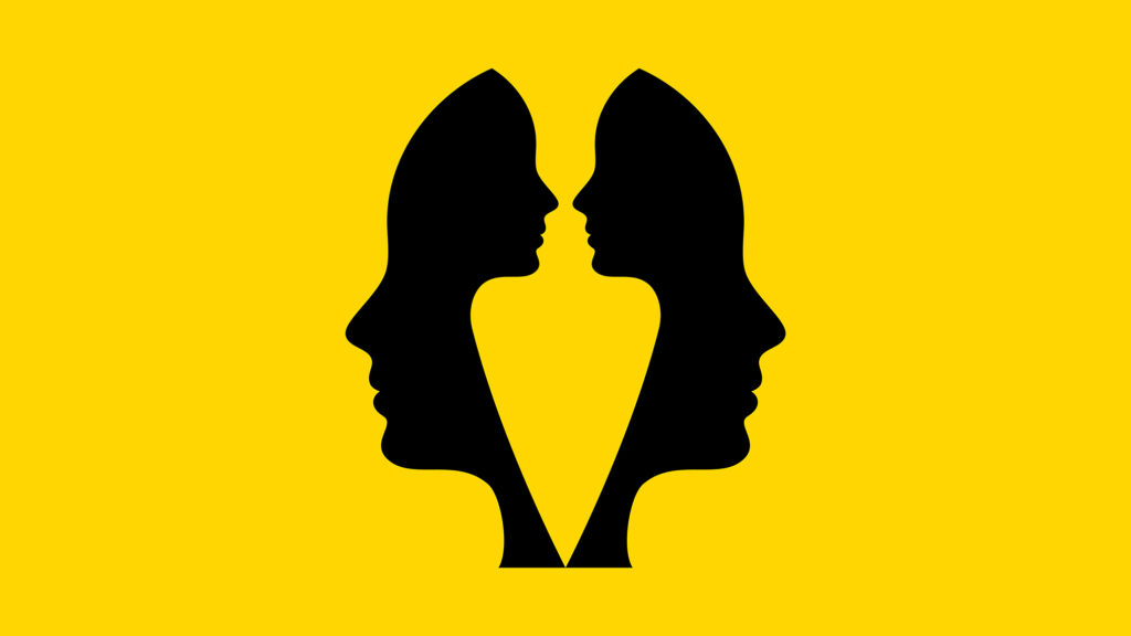 Two black silhouetted profiles of human heads facing each other against a bright yellow background, with the negative space between them forming a vase or chalice shape. The image illustrates the concept of perception, dialogue, and dual perspectives in emotional intelligence, showing how meaning and connection emerge in the space between two people engaging with one another.