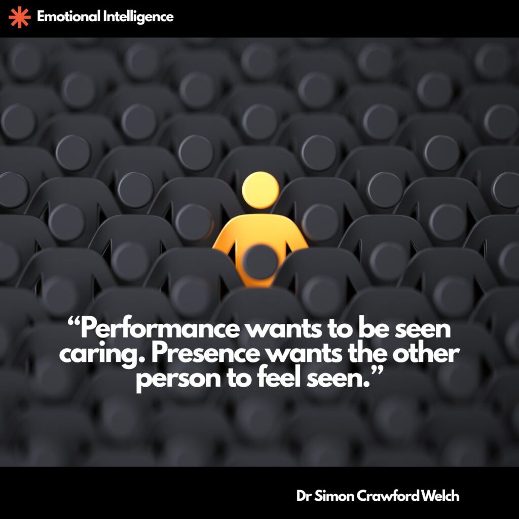 A single glowing yellow figure stands out in the middle of rows of identical dark grey figures, with an Emotional Intelligence label in the top corner. The image represents the rare person who is truly present when everyone else is simply going through the motions. Quote over the image reads: "Performance wants to be seen caring. Presence wants the other person to feel seen." By Dr. Simon Crawford Welch.